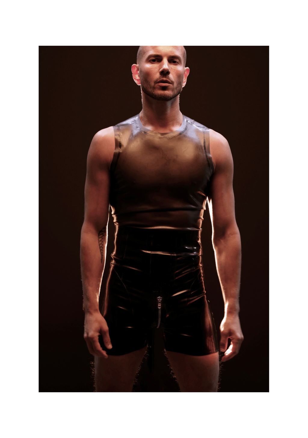 Smoky black translucent rubber tanktop styled with high waisted rubber shorts 